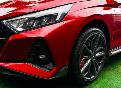 Red hatchback with refurbished alloy wheels